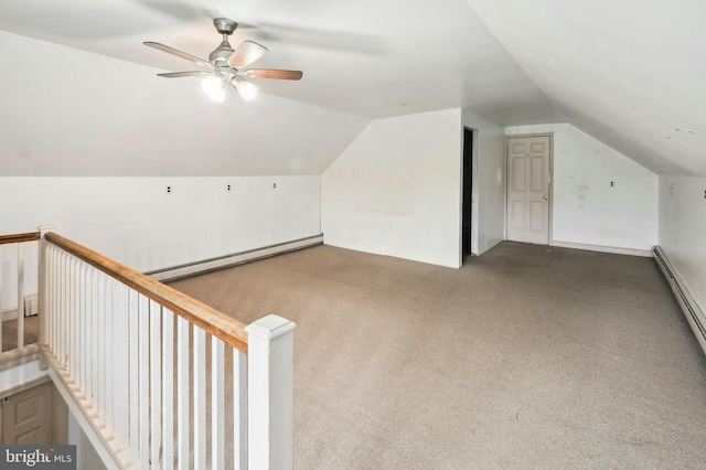 additional living space featuring carpet flooring, baseboard heating, ceiling fan, and lofted ceiling