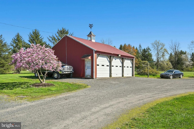 garage with a lawn