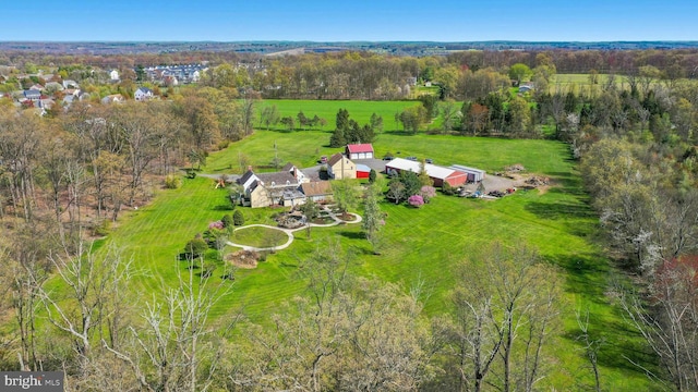 birds eye view of property with a rural view