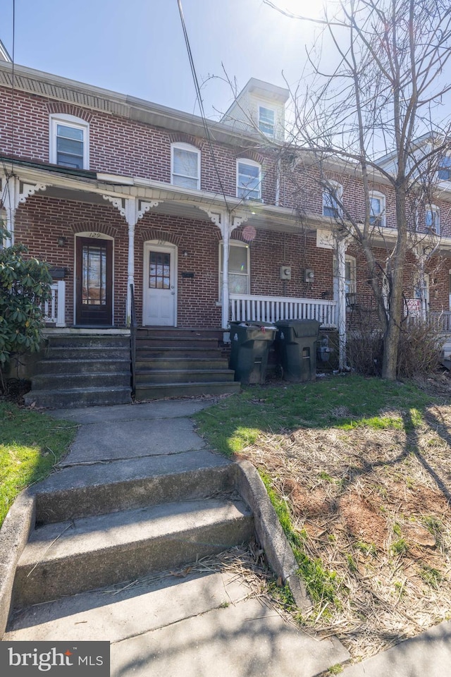 view of property with a porch