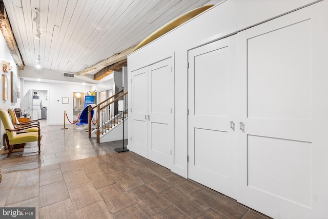 corridor with beam ceiling and wooden ceiling