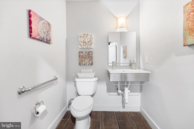 bathroom featuring sink and toilet