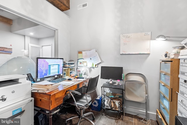 home office with dark hardwood / wood-style flooring