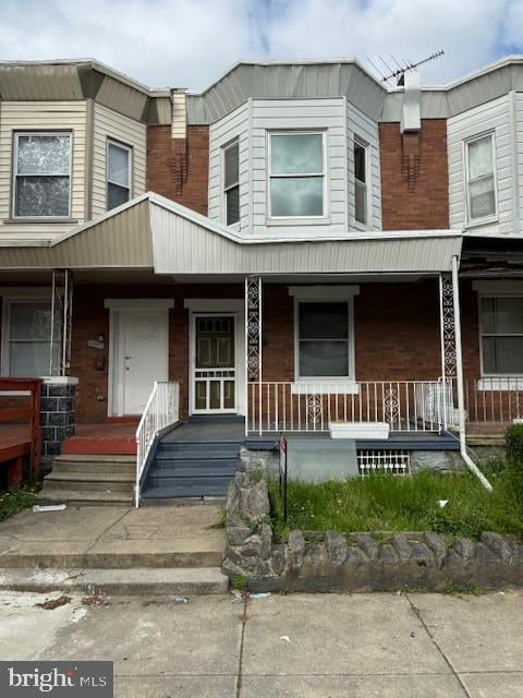 view of property with covered porch