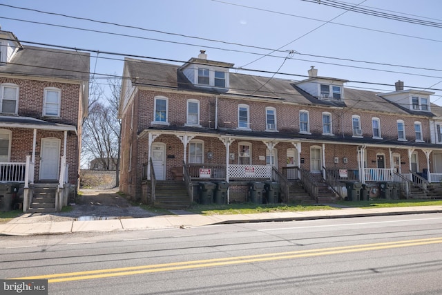 townhome / multi-family property with a porch