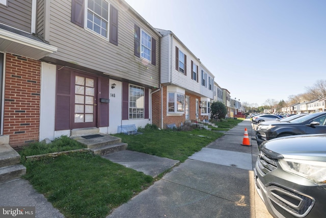 view of property with a front lawn