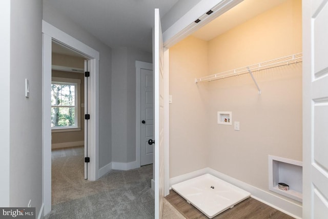 washroom featuring washer hookup and dark carpet