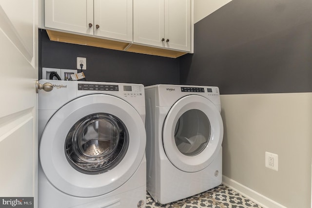 laundry area with light tile flooring, cabinets, washer and dryer, and hookup for a washing machine