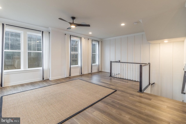 empty room featuring crown molding, ceiling fan, and hardwood / wood-style flooring