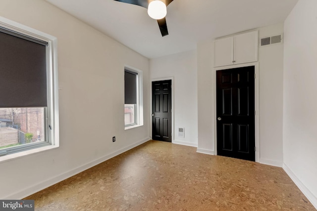 unfurnished bedroom featuring ceiling fan