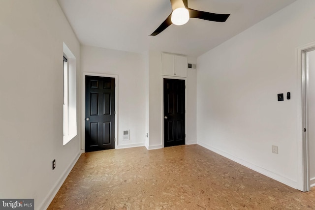 interior space featuring ceiling fan