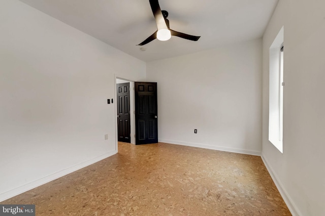 spare room with ceiling fan