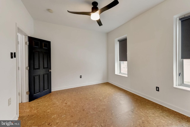 empty room featuring ceiling fan