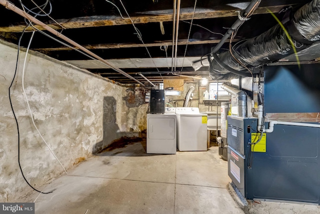 basement featuring sink and washer and clothes dryer