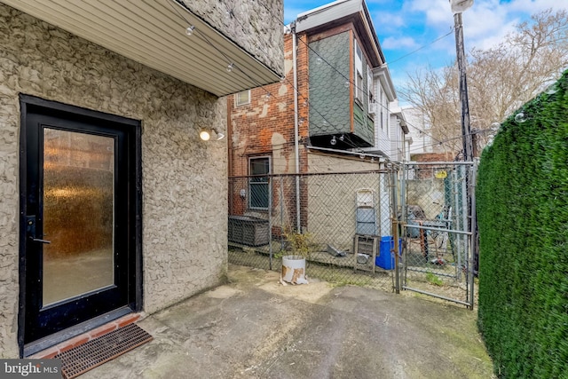 view of side of property with central AC unit