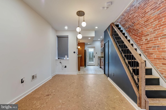 corridor featuring light tile flooring