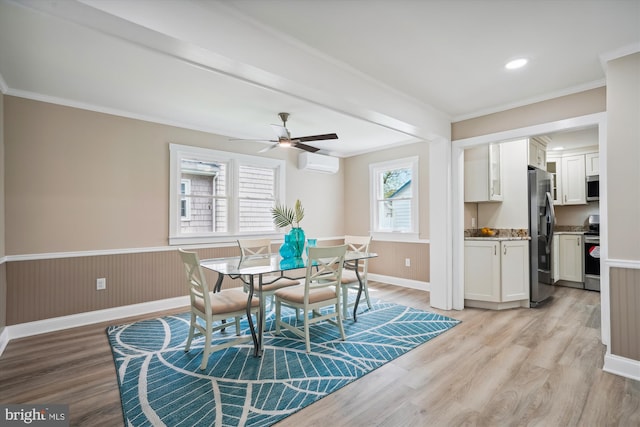 dining space with ceiling fan, ornamental molding, light hardwood / wood-style floors, and an AC wall unit