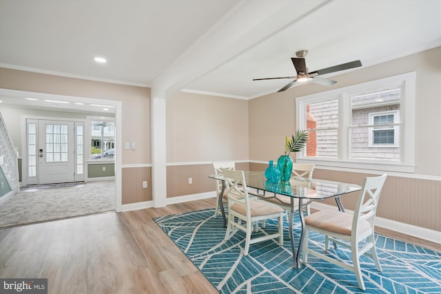 dining area featuring crown molding, ceiling fan, and hardwood / wood-style floors