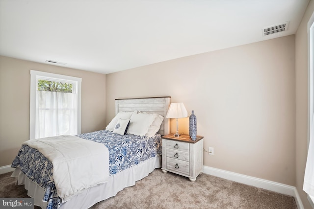 bedroom with light carpet