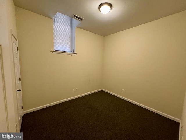 empty room with carpet flooring