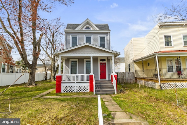 view of front facade featuring a front yard and a porch