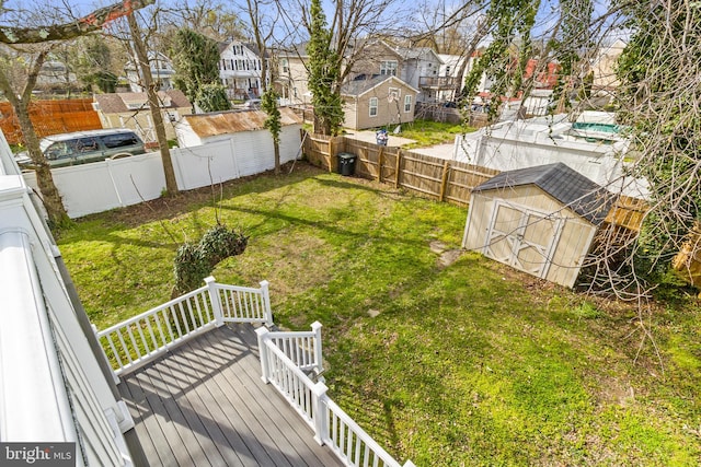 view of yard with a deck and an outdoor structure