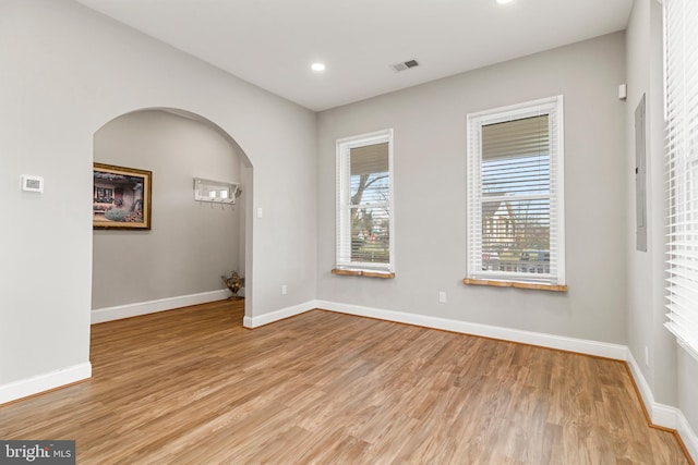 spare room with light wood-type flooring