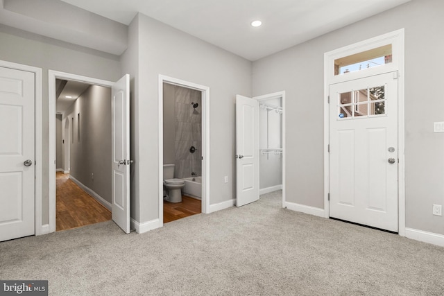 foyer with light colored carpet