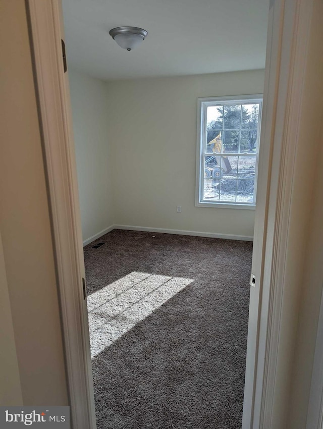 unfurnished room featuring carpet flooring