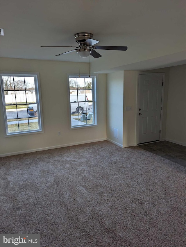 carpeted empty room with ceiling fan