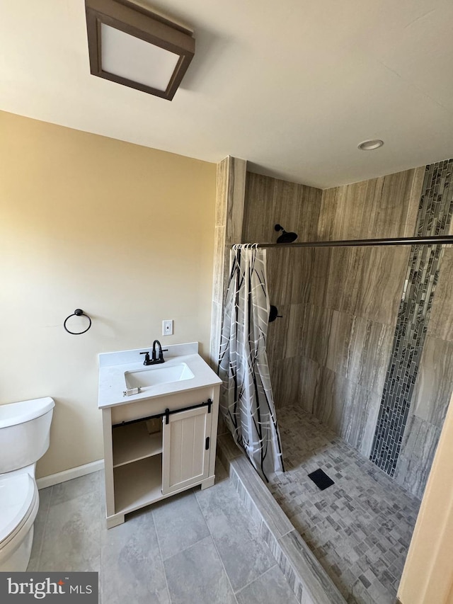 bathroom with vanity, tile floors, a shower with curtain, and toilet