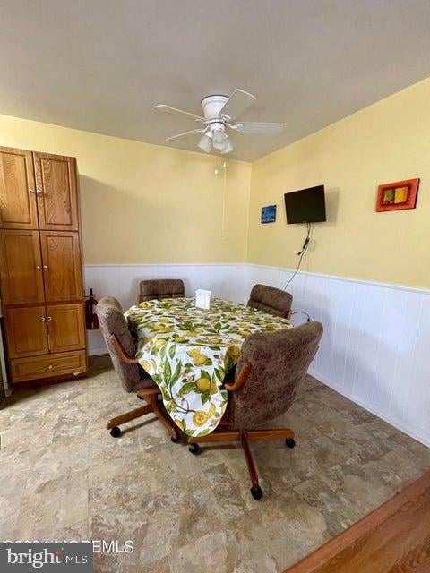 dining area featuring ceiling fan and light wood-type flooring