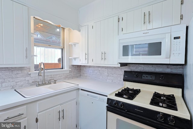 kitchen featuring white cabinets, tasteful backsplash, white appliances, and sink