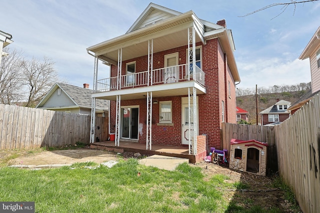 back of house with a balcony