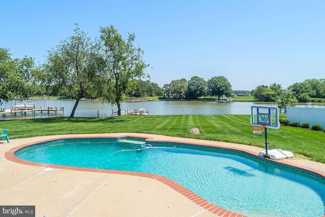 view of swimming pool with a water view, a yard, and a patio