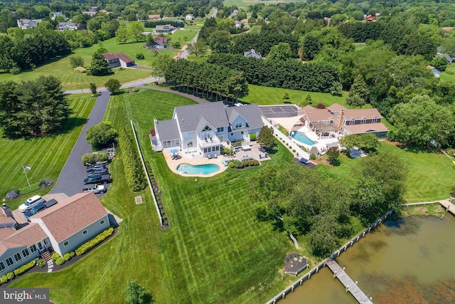 birds eye view of property featuring a water view