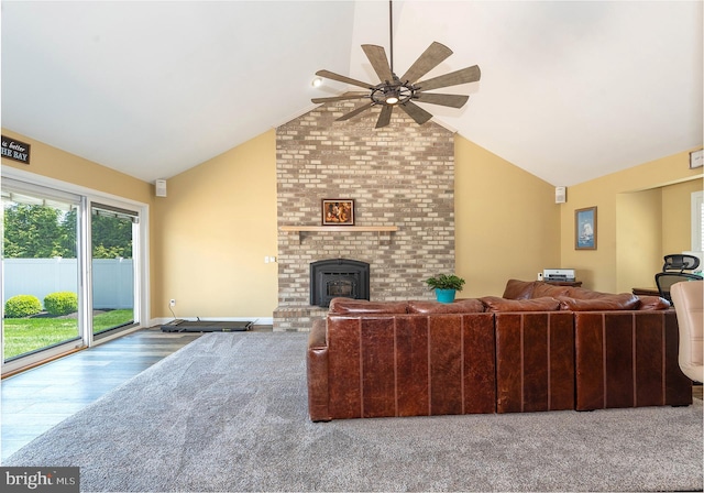 living room with ceiling fan, wood-type flooring, and lofted ceiling