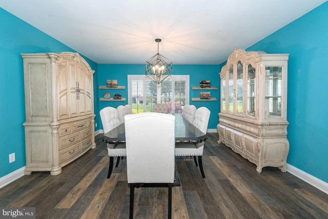 dining space with an inviting chandelier and dark wood-type flooring