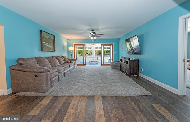 living room featuring french doors, dark hardwood / wood-style floors, and ceiling fan