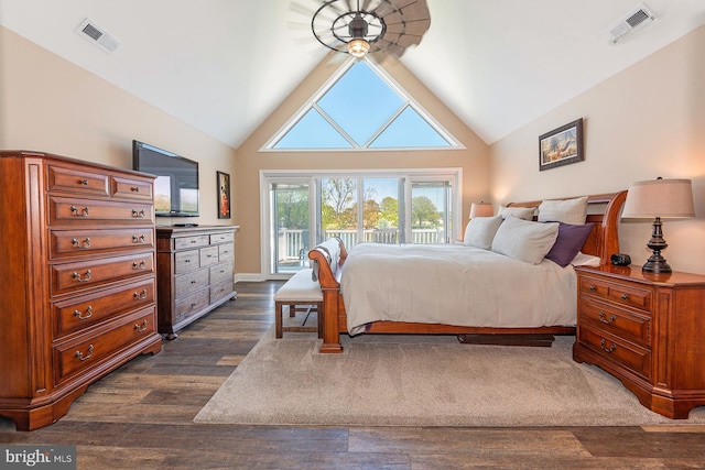 bedroom featuring access to exterior, high vaulted ceiling, and dark wood-type flooring