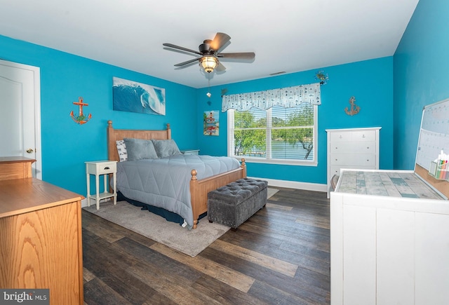 bedroom with ceiling fan and dark hardwood / wood-style floors