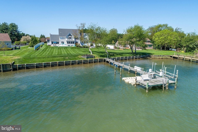 dock area with a water view and a lawn