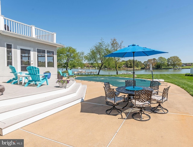 exterior space with a balcony and a water view