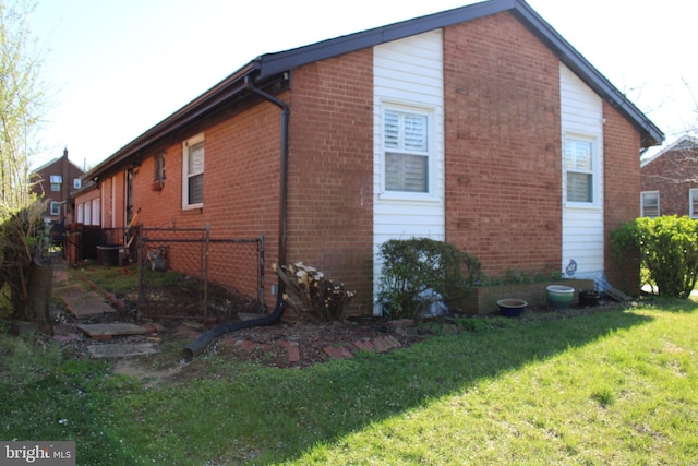 view of home's exterior with a lawn