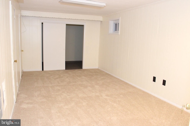 empty room featuring light colored carpet