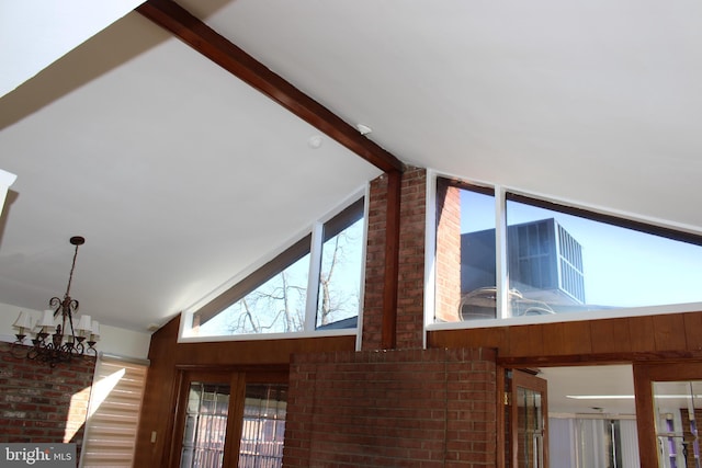 details with an inviting chandelier, beam ceiling, and hardwood / wood-style flooring