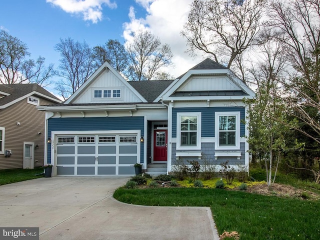 craftsman-style home featuring a front lawn and a garage