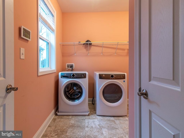 laundry area with independent washer and dryer, washer hookup, and light tile floors