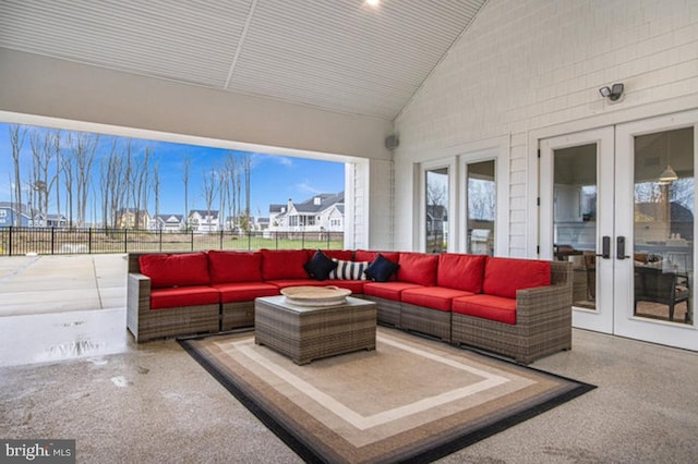 sunroom / solarium with french doors and vaulted ceiling