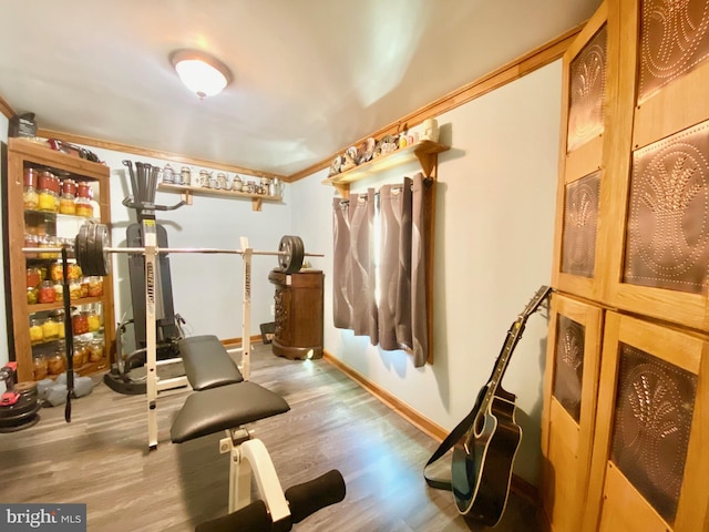 exercise area with light wood-type flooring